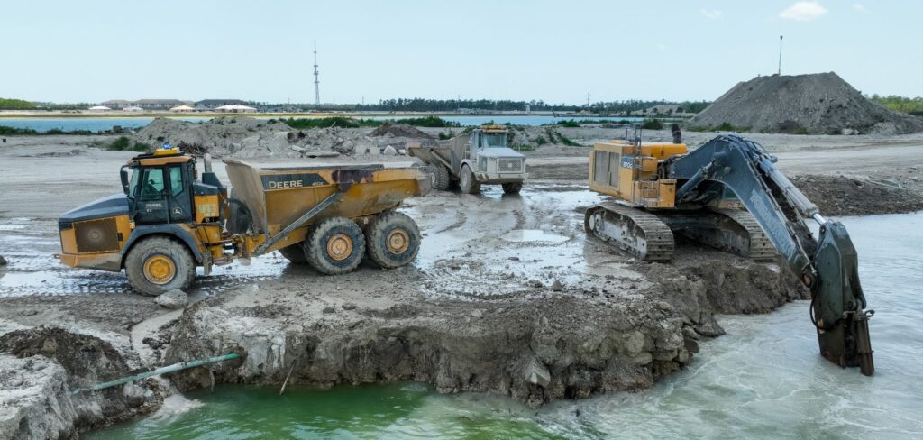 Excavator loading trucks operated by Teleo Supervised Autonomy